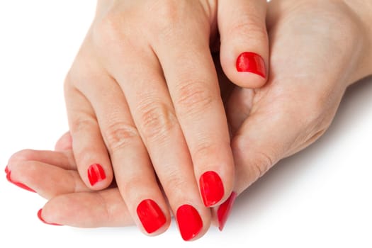 Women's hands with beautiful well-groomed fingers and red nail polish wellness beauty spa close up isolated on white background
