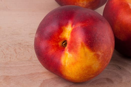Fresh nectarines,oranges,peaches close-up on white background
