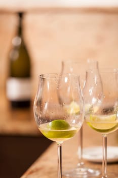 Sparkling wine bottle with wine glasses for an aperitif in a kitchen