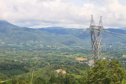 High voltage towers on mountain, High-voltage tower sky background.