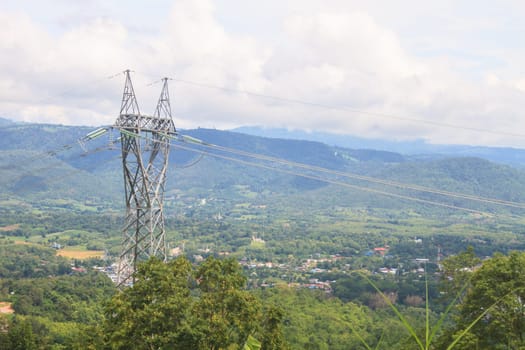 High voltage towers on mountain, High-voltage tower sky background.