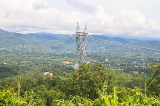 High voltage towers on mountain, High-voltage tower sky background.