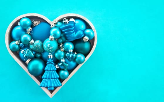 Various blue Christmas tree balls in heart shape
