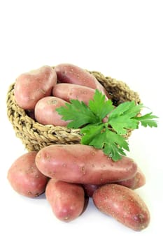 raw,red potatoes against a white background
