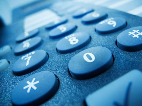 Close-up phone buttons blue toned
