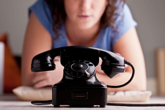Girl waiting for a telephone call