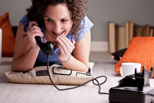 young woman chatting and doing gossip in her room