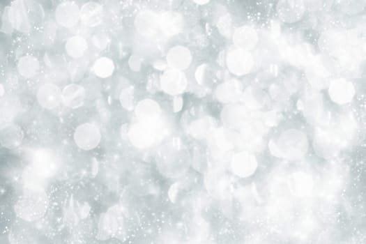 Light silver abstract Christmas background with white snowflakes