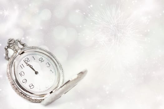 New Year's at midnight - Old clock with stars snowflakes and holiday lights
