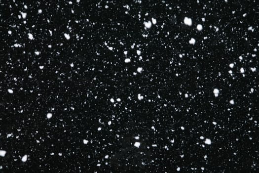 Real snowfall at night