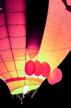 Fire heats the air inside a hot air balloon at balloon festival