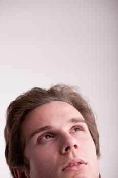 young man thinking about the future or a great idea
