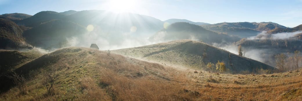 Panoramic view of foggy autumn morning in the mountains