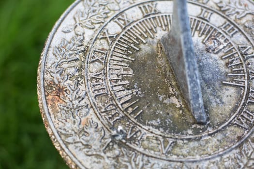 Close up of weathered  sundial in garden