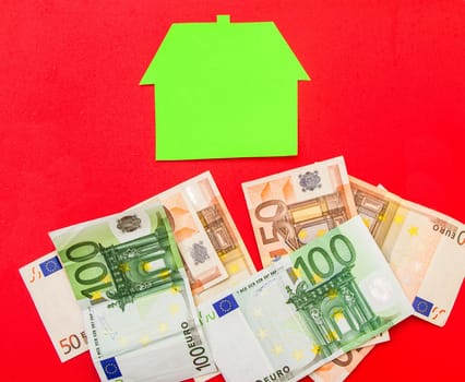 A house over a pile of euros.