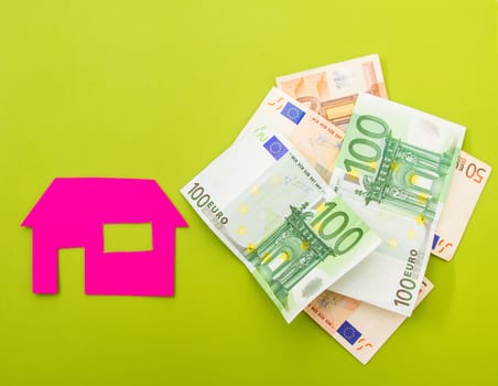 A house near a pile of euros.