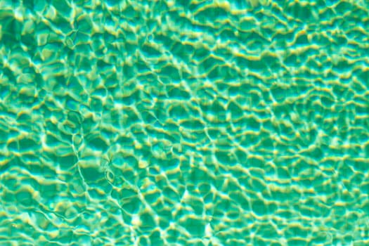 Water on a tiled swimming pool background.