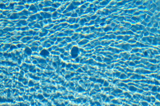 Water on a tiled swimming pool background.