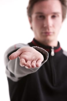 young man pushing out his hand to ask you what you owe him