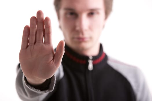 young man pushing out his hand meaning no entry