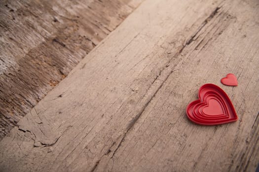 a couple of RED hearts on a scar surface