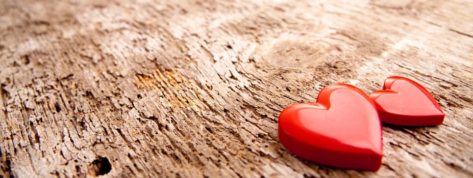 a couple of RED hearts on a scar surface
