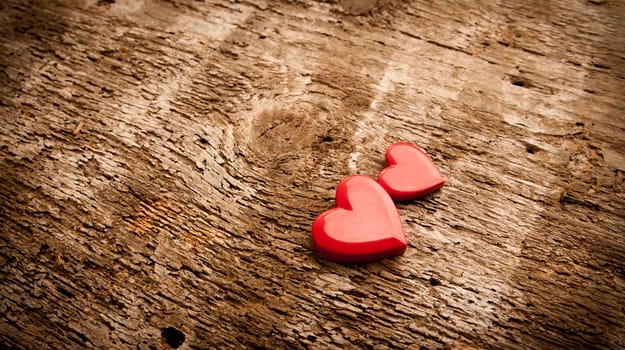 a couple of RED hearts on a scar surface