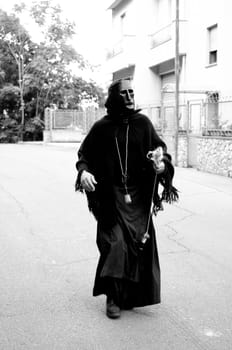 Jerzu, Sardinia - August 3, 2014: Parade of costumes and traditional masks of Sardinia at the Wine Festival August 3, 2014 in Jerzu, Sardinia.