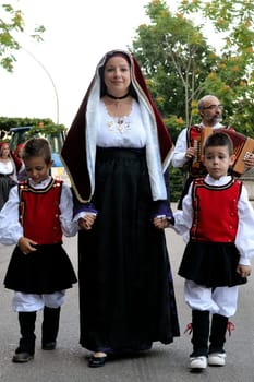 Jerzu, Sardinia - August 3, 2014: Parade of costumes and traditional masks of Sardinia at the Wine Festival August 3, 2014 in Jerzu, Sardinia.