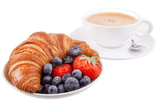Croissant with coffee and berries