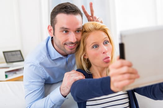 View of a Young attractive couple having fun doing selfie