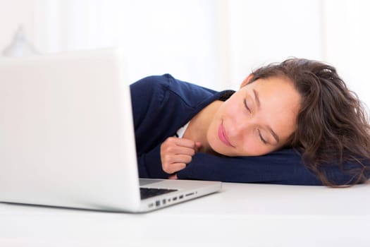 View of a young student in front of laptop