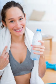 VIew of a Woman drinking water after a sport session