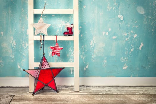 Christmas stars on decorative ladder