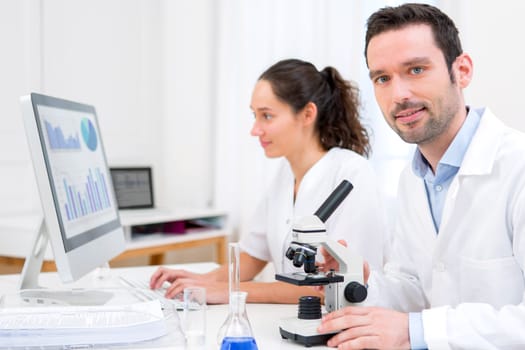 View of a Scientist and her assistant in a laboratory