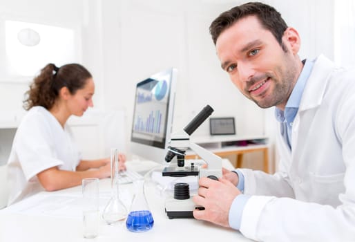 View of a Scientist and her assistant in a laboratory