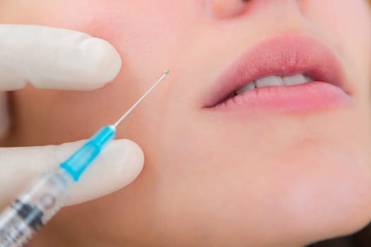 Detailled close up view of a lip injection