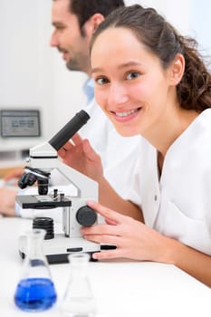 View of a Young attractive woman working in a laboratory