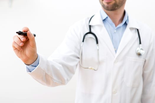View of a Professional doctor writing on a touchscreen interface