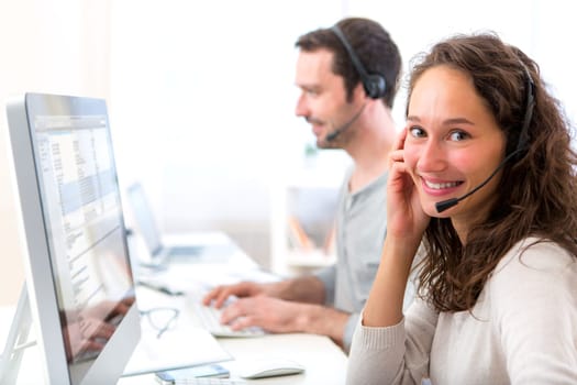 View of a Young attractive woman working in a call center