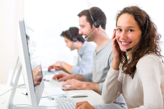 View of a Young attractive woman working in a call center