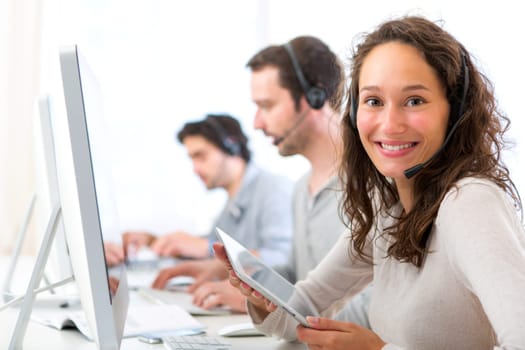 View of a Young attractive woman working in a call center