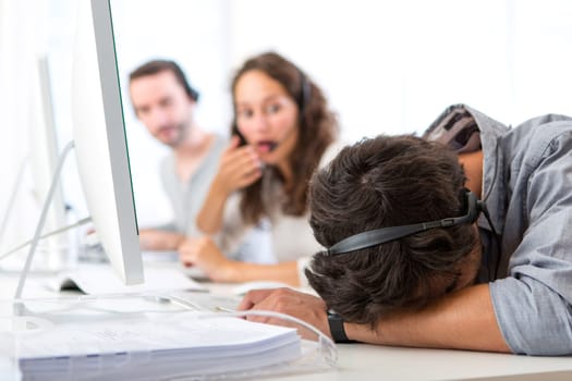 View of a Young attractive man ill-at-ease at work