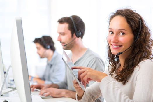 View of a Young attractive woman working in a call center