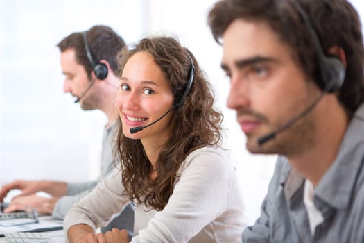 View of a Young attractive woman working in a call center