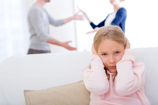 View of a Young child blocked up her ears while arguing