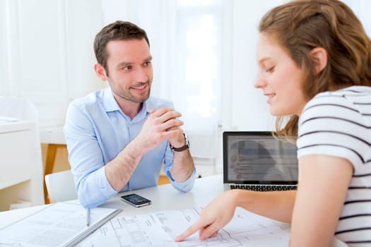 Real estate agent and customer at the office