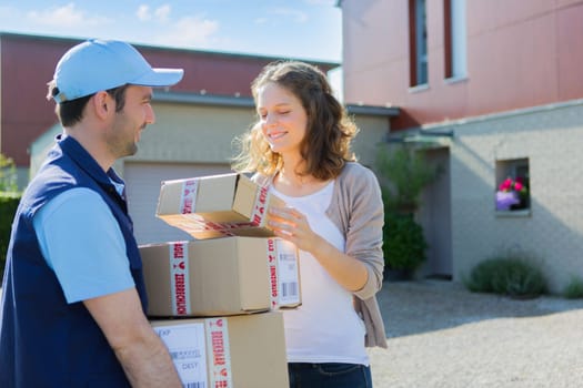View of a Young attractive woman checking her parcel