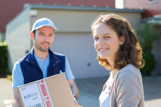 View of a Young attractive delivery man on his way to customer