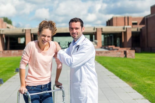 VIew of a Young doctor assisting a young woman